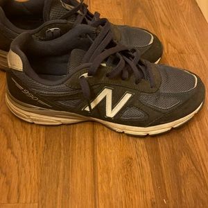 Boys size 7 New Balance. Slightly worn. Good cond